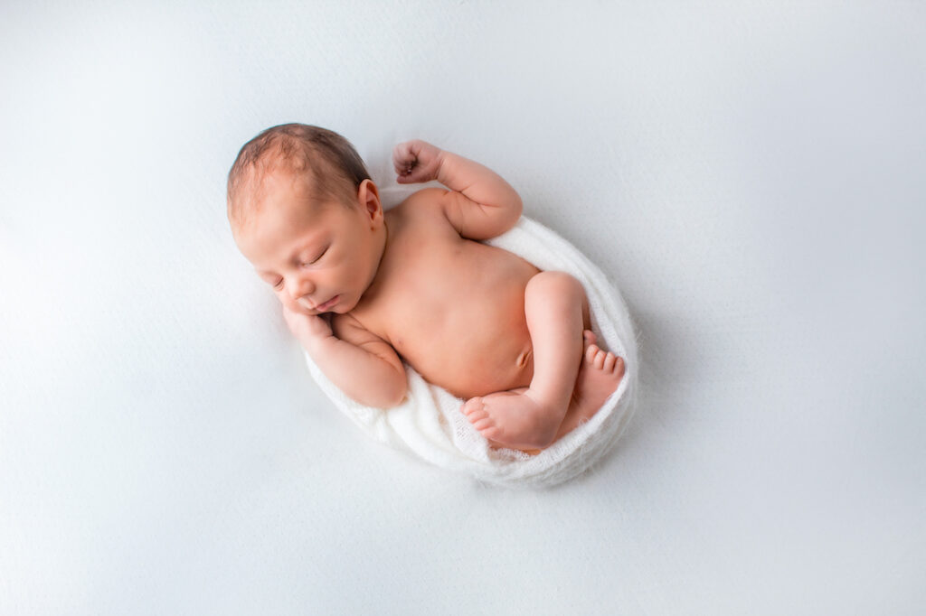 minimalist photoshoot baby wrapped in white jersey cloth brisbane qld